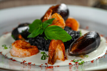 seafood, mussels, salmon on a white plate
