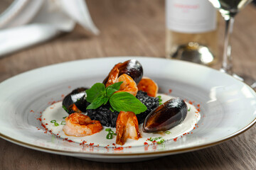 seafood, mussels, salmon on a white plate