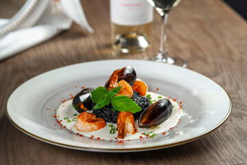 seafood, mussels, salmon on a white plate