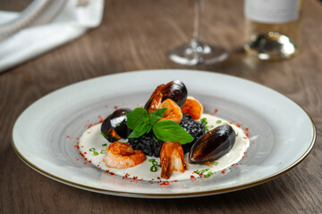 seafood, mussels, salmon on a white plate