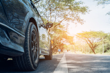 close up car on street automotive roadtrip on sunset background