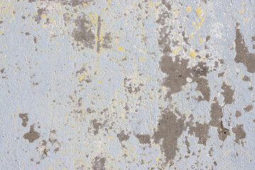Vintage wall texture. Weathered rough surface of a concrete wall with peeling stucco and faded paint. Great for background and design. Closeup. High resolution.
