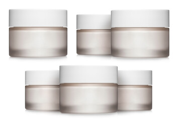 Collection of white cosmetic cream jars, isolated on white background