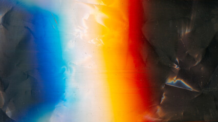 Aged film texture. Dust scratches noise. Weathered foil. Orange blue white rainbow color light...