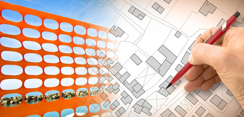 Construction site with safety orange plastic grid on a workplace against a city map - concept image