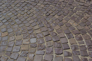 Cobblestone road. Gray cobblestone texture, vintage road surface