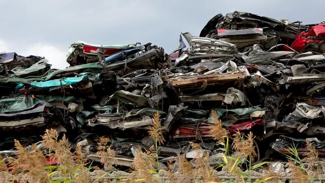 Stacked cars on a junkyard in Poland, 4k video