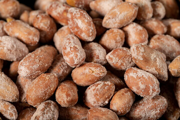 Salted peanuts on dark background. Pile of peanuts. Studio shoot. close up