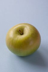 Creative pattern with apples on bright light blue background