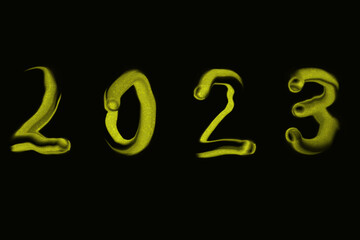 yellow numbers 2023 on a black background