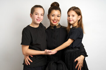 Beautiful young family portrait on a white background