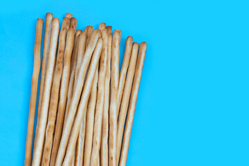 Bread sticks on blue background