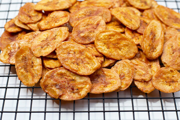 Banana chips on white background