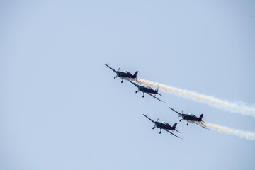 aerobatics on sports planes over the sea in the sky of Jordan