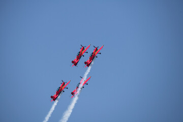 aerobatics on sports planes over the sea in the sky of Jordan