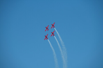 aerobatics on sports planes over the sea in the sky of Jordan