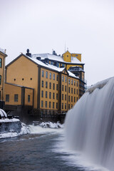 The river Motala Ström (Strömmen) by old industrial buildings, a landmark of Norrköping, Sweden