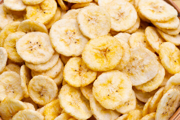 Banana slice chips on white background.