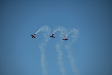 aerobatics on sports planes over the sea in the sky of Jordan