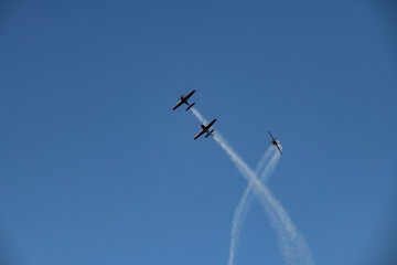 aerobatics on sports planes over the sea in the sky of Jordan