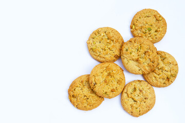 Pistachio and almond cookies on white background.