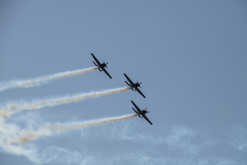 Fototapeta na wymiar aerobatics on sports planes over the sea in the sky of Jordan