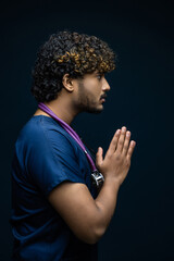 Closeup portrait, young depressed man healthcare practitioner isolated black gray background