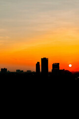 Fototapeta na wymiar The silhouette sunset over Bangkok city skyline. verticle picture