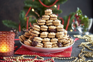 Christmas cookie filled with strawberry marmalade and dipped in chocolate