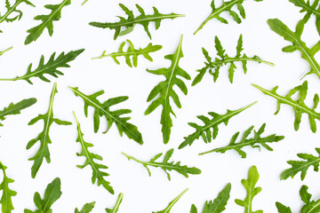 Fresh green rocket salad on white background.