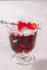 Valentine's day cocktail with dry ice on dark background