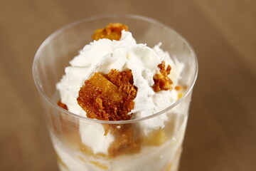 Ripe mango honeycomb candy dessert with whipped cream