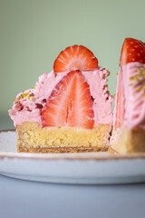 Strawberry Mont Blanc dessert with whipped cream and fresh strawberry on a silver table