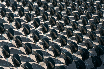 Empty seats in a row for fans in the arena. Lots of empty seats for spectators in the stands. Seat frame made of high quality plastic. Chairs are ideal for various mass sports events, concerts.