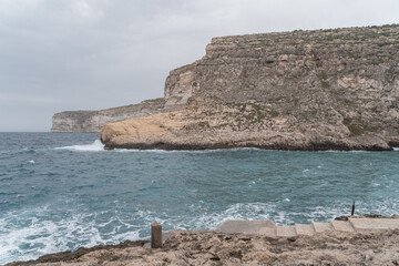 Cliffs at Xlendi in Gozo. With views over the sea. 