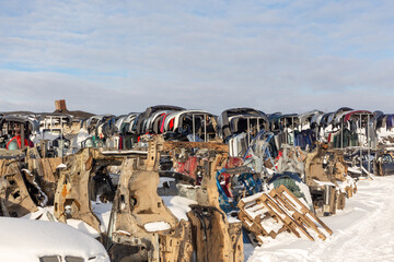 Disassembled cars on a car dump are on sale for spare parts.