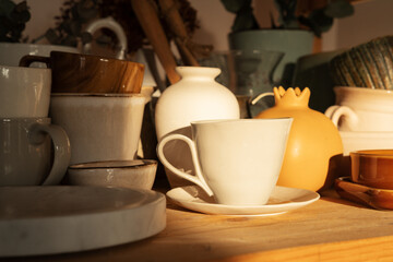 Various of ceramic cups on wooden surface. ceramic background