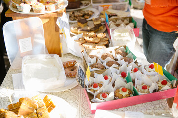 Table full of different baked goods, muffins, cookies and cakes