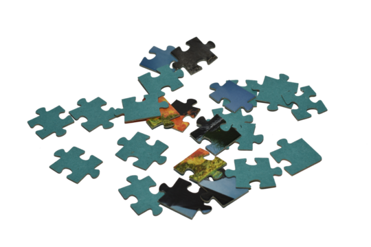 Puzzles scattered randomly on the table, close-up.