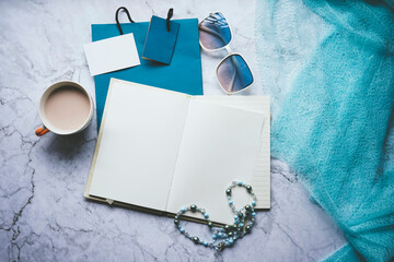 Flat lay for fashion blogger with a blank notebook and accessories