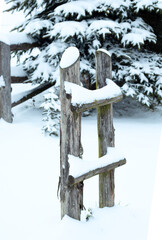 Wooden fence in winter snow landscape