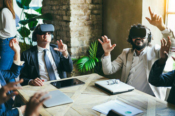 Multiethnic business people wearing vr goggles inside office - Metaverse, 3d and virtual reality...