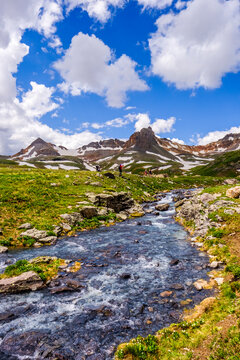 Ice melting near by lake in mountains, Ice Lakes Trail, Colorado, USA