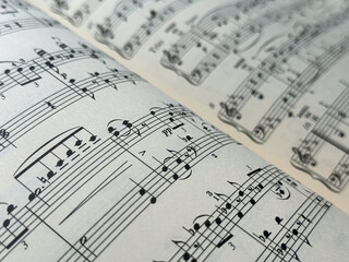 Closeup of Sheet Music. Musical Notes with Selective Focus. close up of a musical pentagram on a music sheet. 
