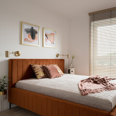 Elegant bedroom with bed in velvet frame