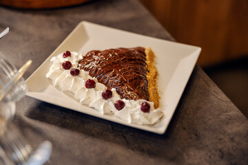 A delicious flapjack with sweet cream and topping ready to eat.