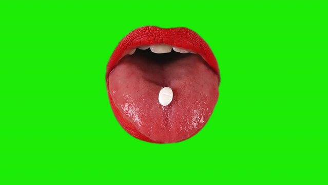 Pill Tongue Female Mouth Red Lipstick Green Screen Medical Background. Medical pill on the tongue of a woman wearing red lipstick on a green screen background