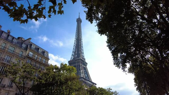 Iconic Eiffel Tower During Sunny Day With Clear Sky In Paris, France. Low Angle