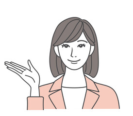 笑顔で案内するスーツ姿の女性 ピンク