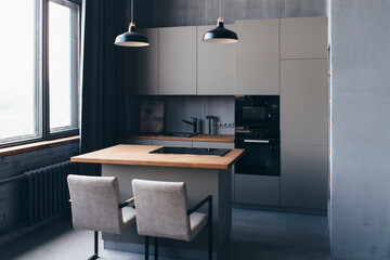 Modern kitchen interior design with furniture and table.